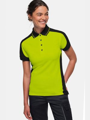 Grünes Damen Arbeits Poloshirt mit schwarzen Kontrasteinsätzen und Vier-Loch-Knopfleiste – strapazierfähig und pflegeleicht für Handwerk, Pflege und Gastronomie.