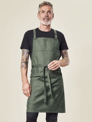 Grüne Latzschürze in Denim-Optik mit verstellbarem Nackenband, aufgesetzten Taschen und Geschirrtuchschlaufe – ideal für Gastronomie, Floristen und Verkauf